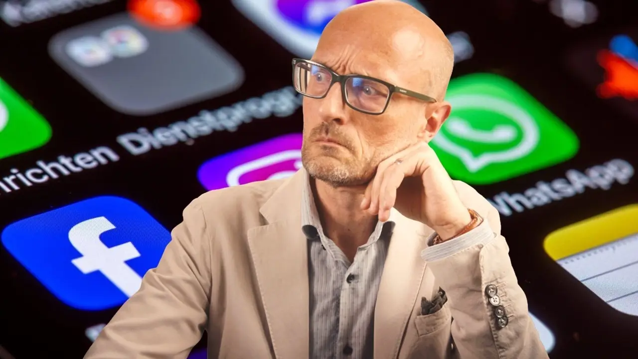 Patrick Boyle in front of a phone screen of app icons, including Facebook and WhatsApp