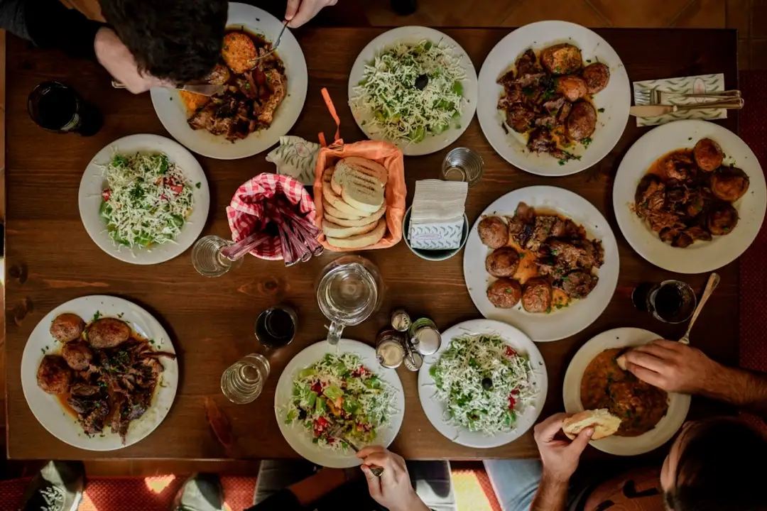 Plates of Sunday lunch on a long table