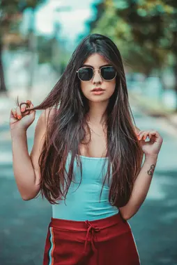 Luca’s photo of his daughter Sofia on a road trip, in sunglasses, holding her hair