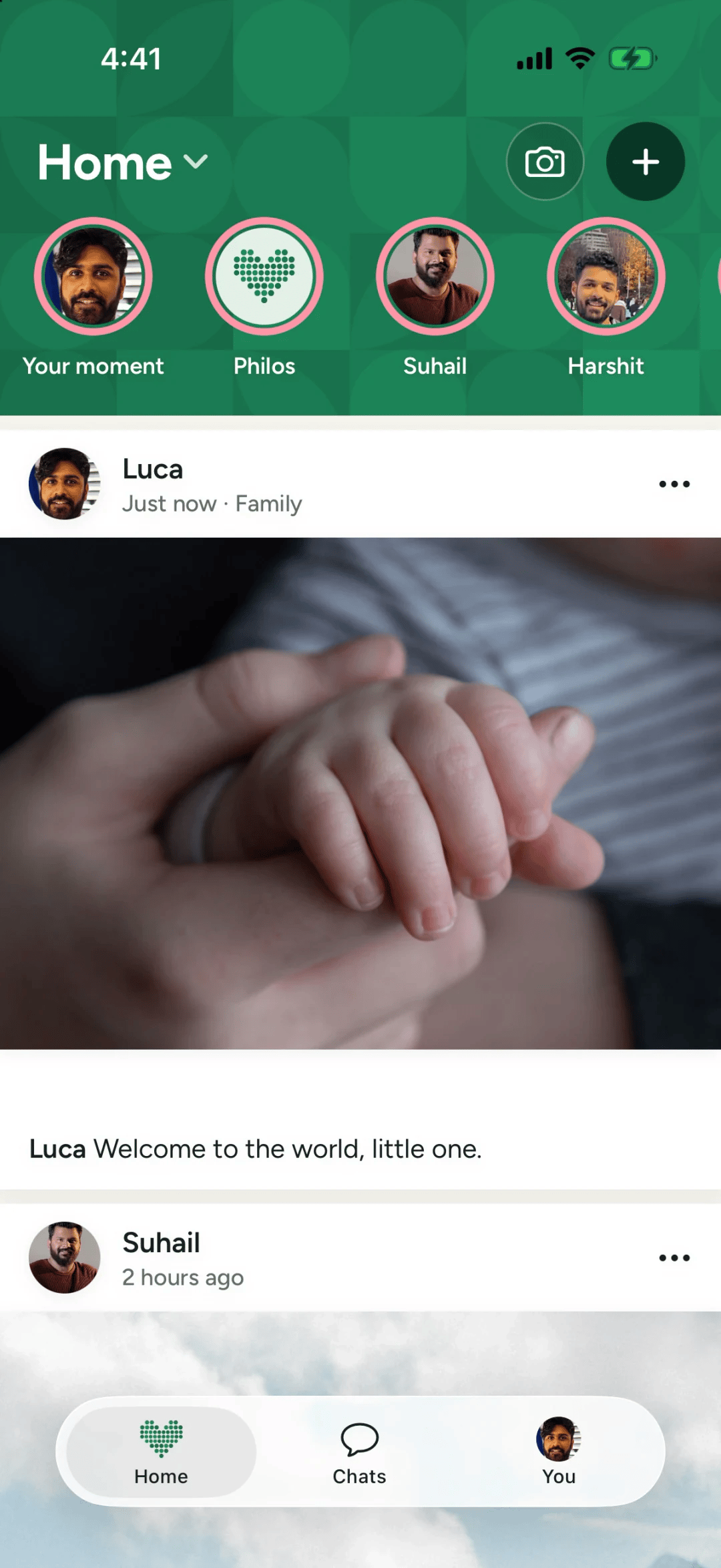 A Philos post of a newborn's tiny hand holding a finger, shared with Family