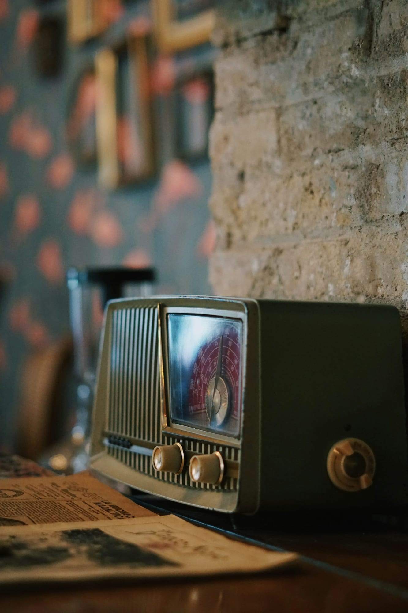 An old radio on a stone shelf